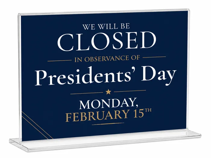 Horizontal Countertop Sign Holder with a holiday closing sign inserted